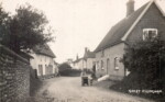 Church Street also known as The Street. Islay House on the right. Ye Olde Thatche Shoppe on left and the Crown in the background. Postcard Carol Ewin
