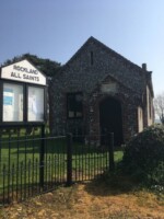 Flint stoned hall in the churchyard of Rockland All Saints Church