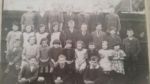 Rocklands School. Believed to be 1928. Reading left to right. Back row: Dorothy Skipmore, Irene? Webster, Unknown, ? Woods, ? Woods, Leslie Banham, Unknown.
Middle row: Margaret Skipmore, ? Webster, ? Ayers, Sybil Banham,Ben Hutson, Charlie Algar, Arthur Fisher, Norman Goddard, Arthur Webster.
Front row: Stanley Fisher, Marjory Goddard, Peggy Goddard, ?Maud Skitmore, ? Ayres, Ethel Webster, Jack Skitmore, Ethel Banham, ?Maud Skitmore's sister.
Kneeling: Cyril Algar, Alan Hutson, Billy Banham.
Jack Reynolds and Leonard Houchen are believed to be in the photograph. Photograph Alan Gardiner
