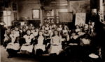 Great Ellingham School (Girls) possiby early 1900s. Are the boys in the adjacent classroom? Photograph Ray Beales