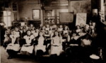 Great Ellingham School (Girls) possiby early 1900s. Are the boys in the adjacent classroom? Photograph Ray Beales