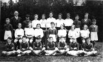 1938 Great EllinghamSchool Representatives at County Sports. Back Row (facing) left to right: Mr Fordham, Brian Fiddy, Jean Bilverstone, Rita Bunting, Beryl Laws, Rita Wigby, Ethel Lincoln, Colin Wilkins & Mrs Fryer. Middle Row (facing) left to right Johnnie Reeder, Ethel or Violet Lister, Corona Beales, Joan Woor, Alec Stubbings, Barbara Mace, Irene Beales or Ethel or Violet Lister, Dorothy Lister, Arthur Stubbings. Front Row (facing) left to right Alan Cursons, Ernie Filby (Rusty), Ralph or Leslie Brooks, Roy Melton, John Penson, Fred Drewry & Wack Kemp. Photograph courtesy of David Fowle. Identification also from Great Ellingham Primary School Centenary Book 1896 to 1996 (J.E. Watts)