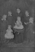 Emily Houchen nee Rivett with some of her children. Likely to be William, Emma, Charles, Leonard, Sarah and Frank all born in Great Ellingham. Possibly taken around 1891. Courtesy of Pauline Bezant