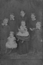 Emily Houchen nee Rivett with some of her children. Likely to be William, Emma, Charles, Leonard, Sarah and Frank all born in Great Ellingham. Possibly taken around 1891. Courtesy of Pauline Bezant