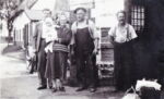 Blacksmith Andrew King in the centre with his wife, Mary Naomi King holding a grandson. Two sons of the couple also in the photograph which was taken outside his Smithy in Great Ellingham. Photograph courtesy of Patricia Whiteaker