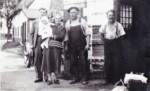 Blacksmith Andrew King in the centre with his wife, Mary Naomi King holding a grandson. Two sons of the couple also in the photograph which was taken outside his Smithy in Great Ellingham. Photograph courtesy of Patricia Whiteaker