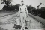 Louis Lebbell (son of William & Lily Lebbell) with pails of milk in Long St c.1932. Photograph courtesy of Susan Fay